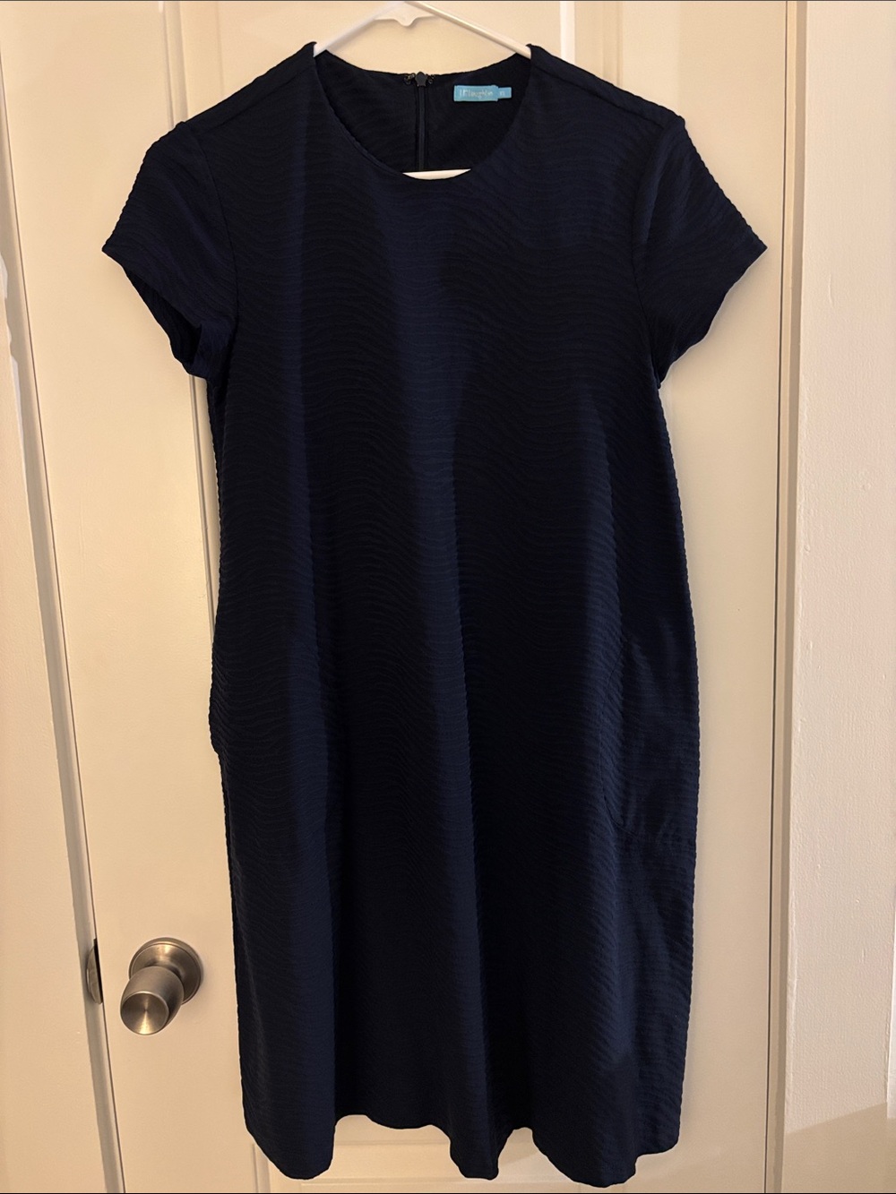 Women - short sleeved, classic, textured navy blue J. McLaughlin dress.